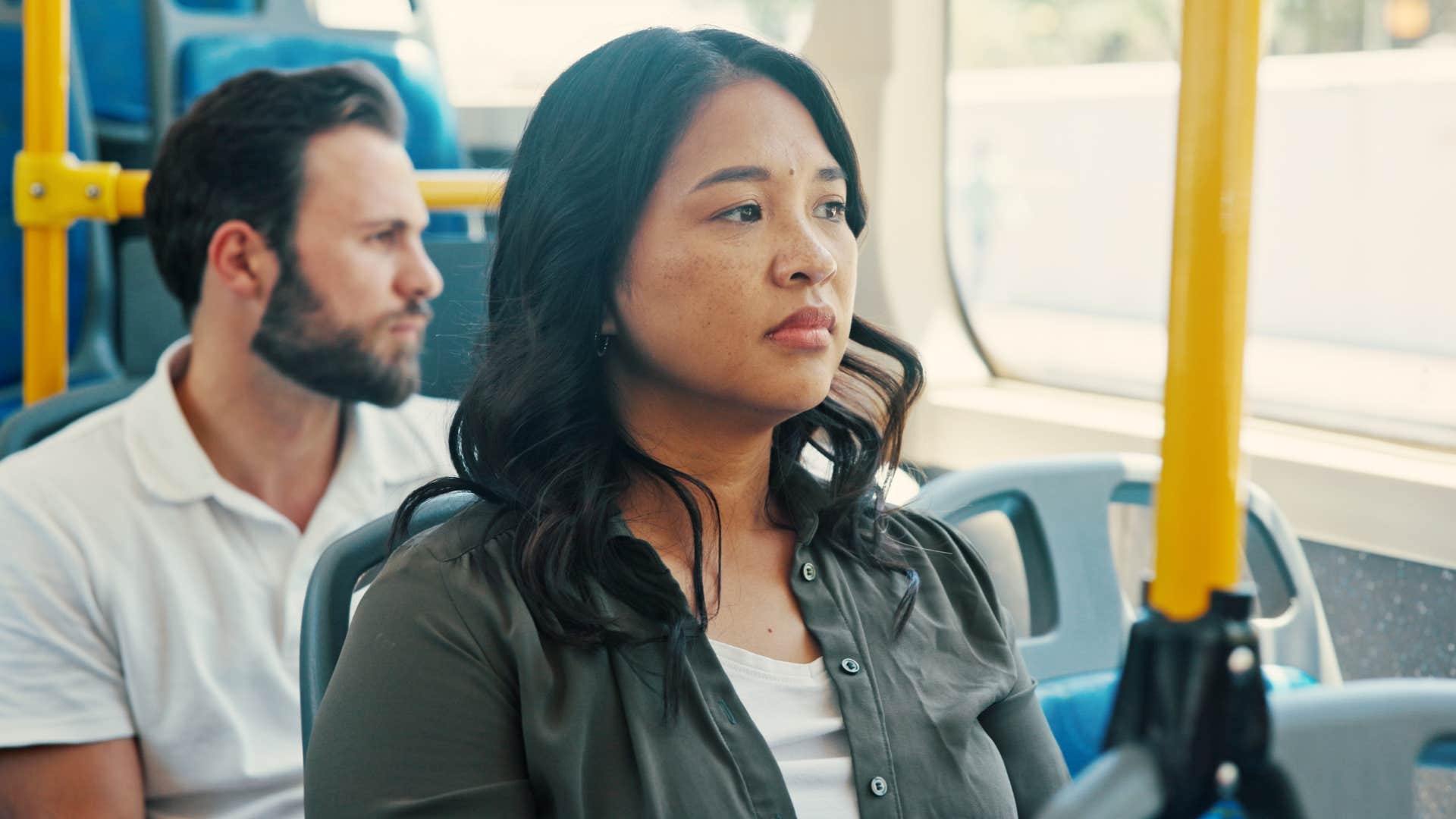 woman looking out window as she has high sensory awareness