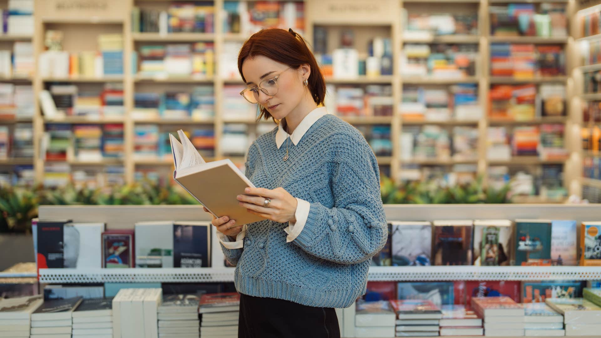 highly intelligent woman reading in a library