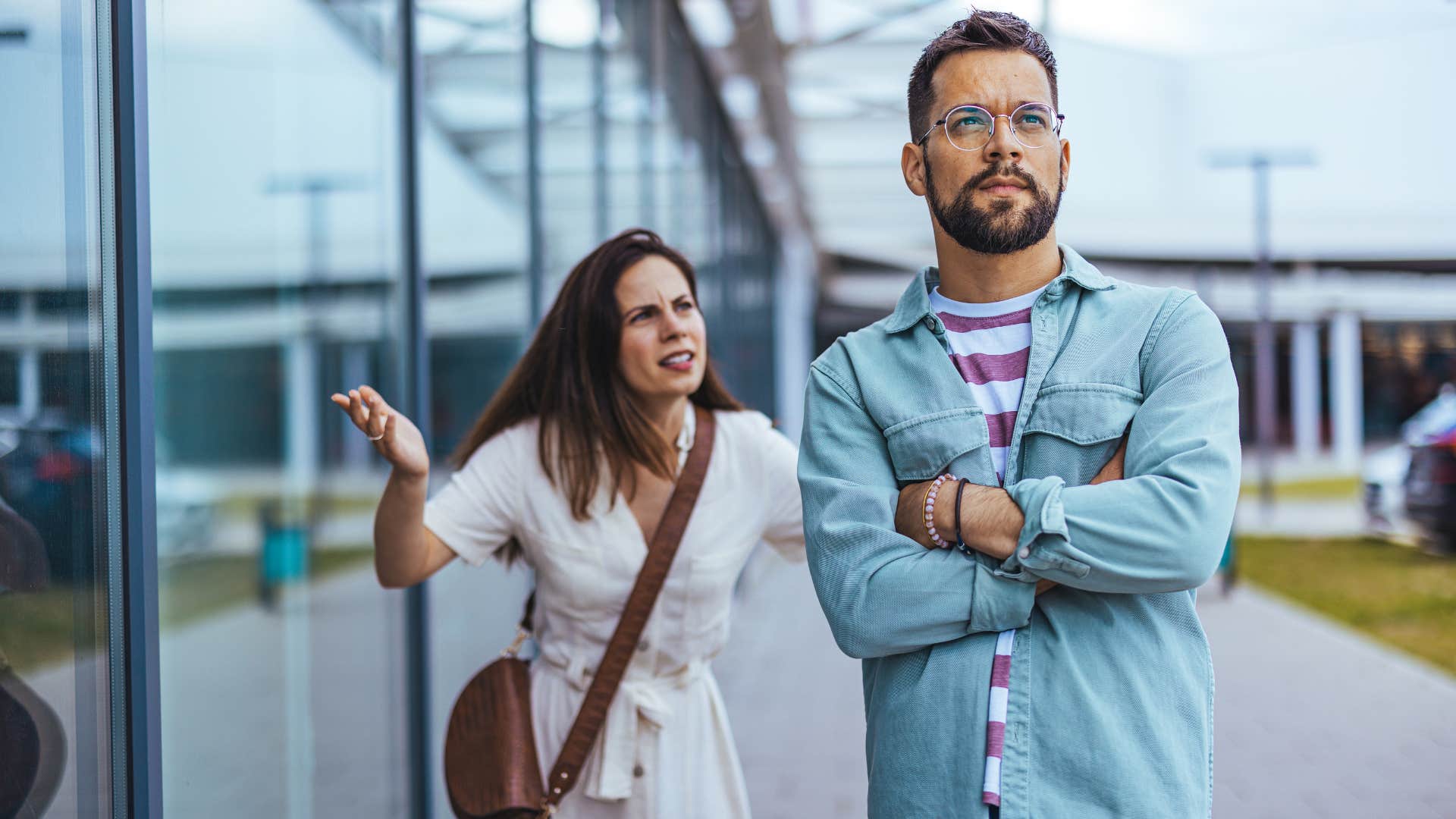Defensive person ignores upset partner showing struggle with relationships