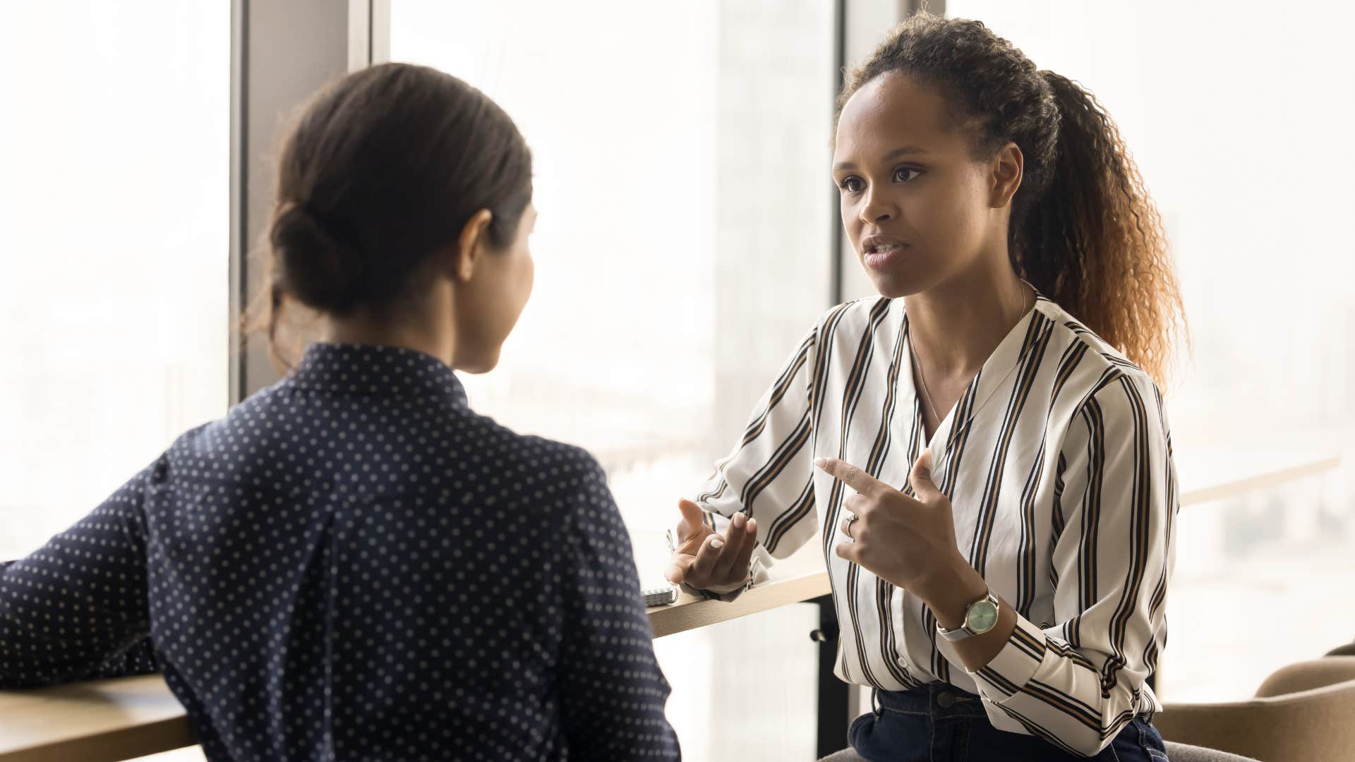 woman telling colleague we should hang out sometime