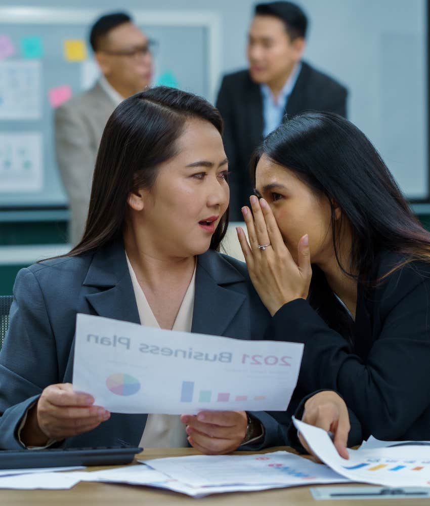 Insecuee person gossips with coworker 