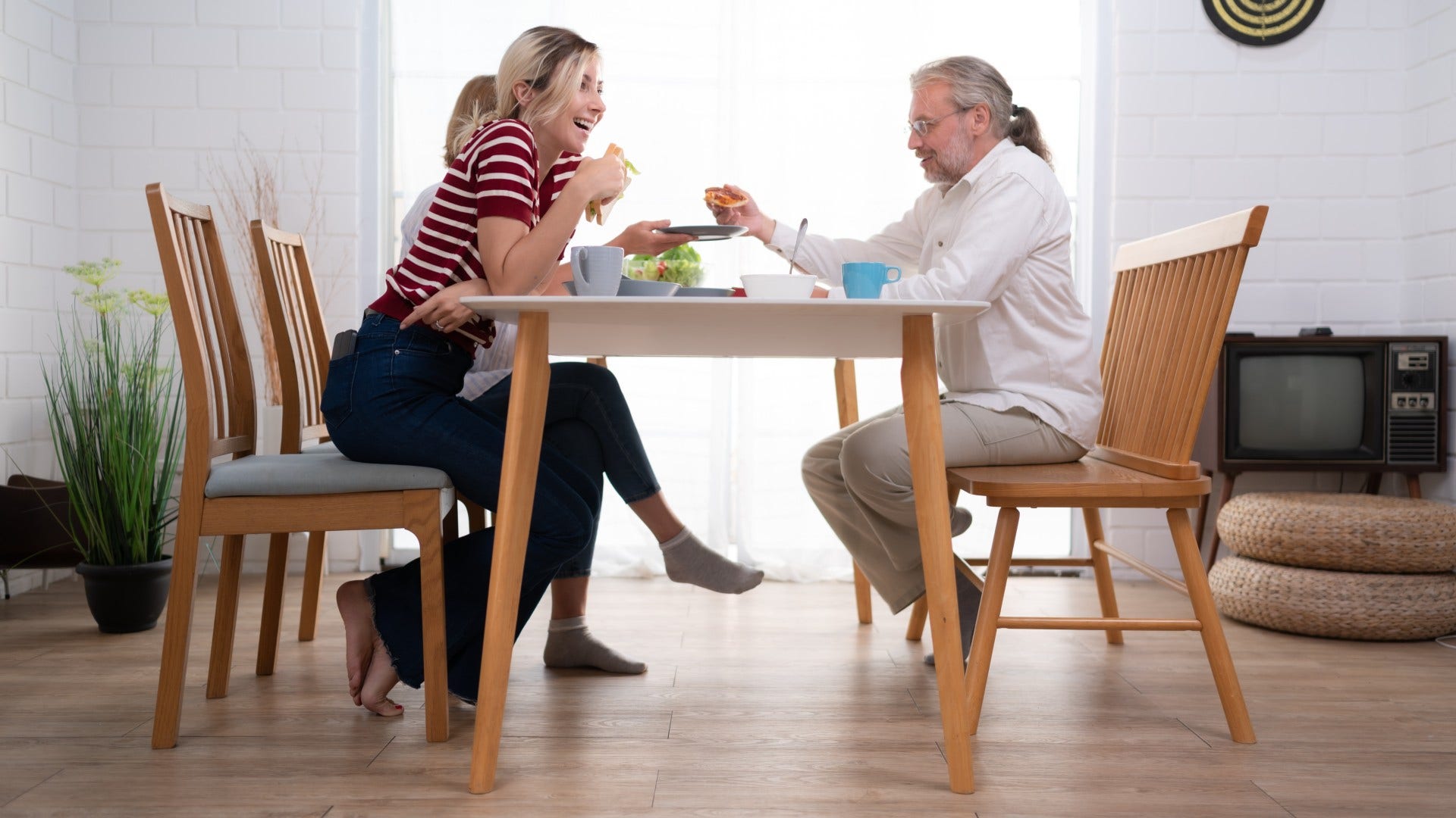 family who still keep photo albums using their dining table