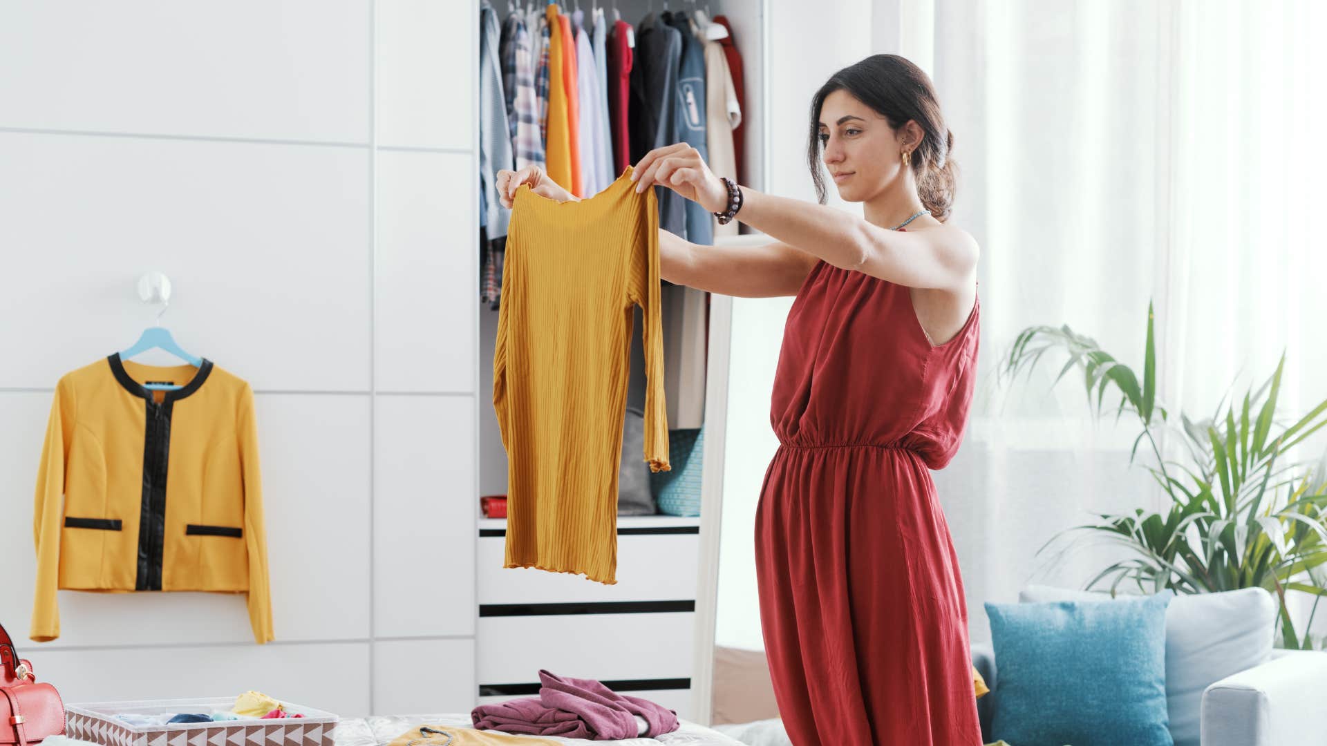woman planning out her outfit for the next day