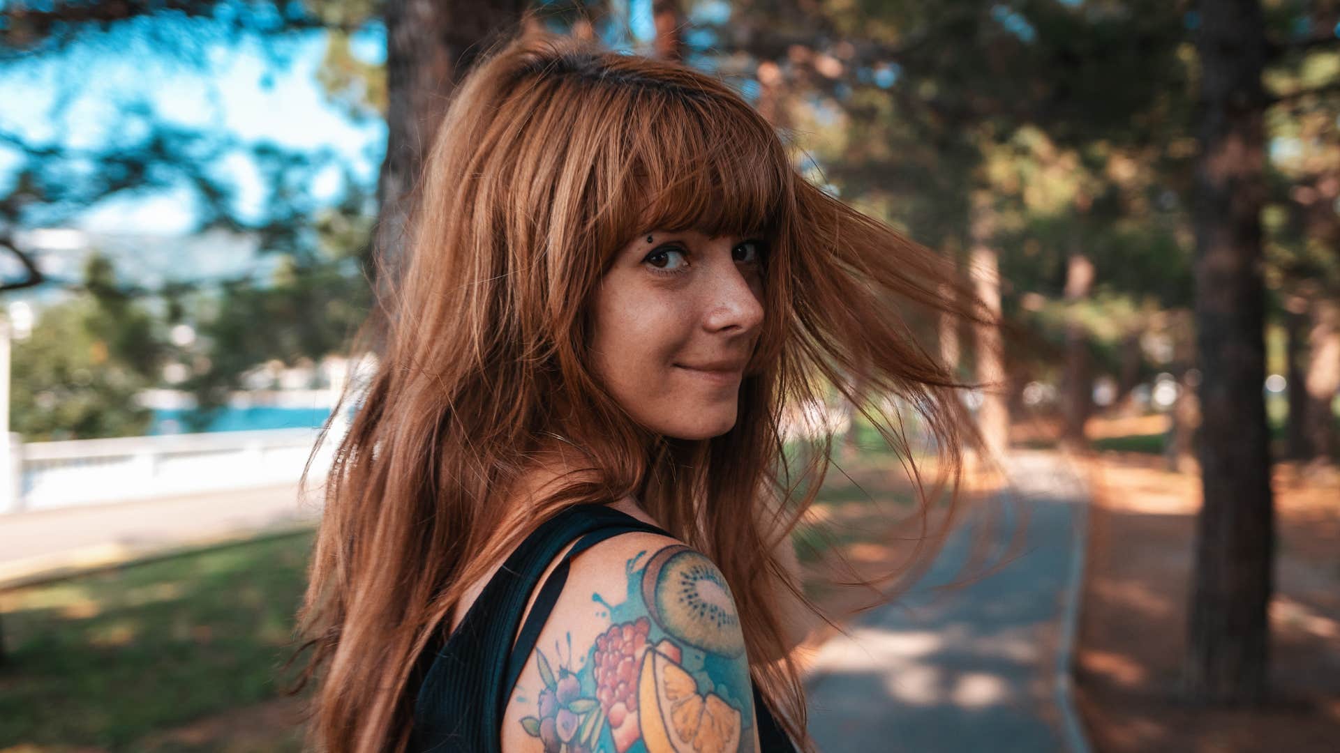 authentic woman smiling walking outside avoiding anyone she knows in public