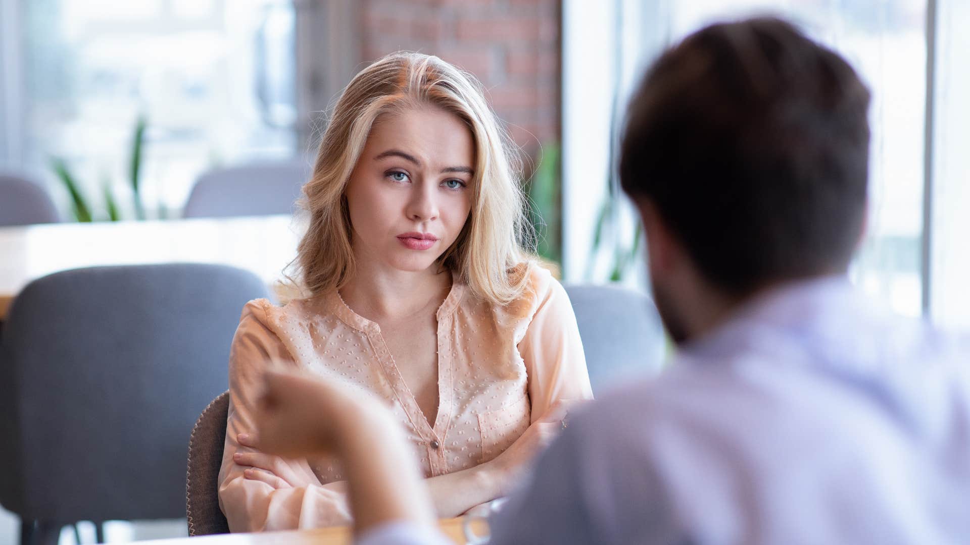 woman who hates small talk feeling bored in conversation