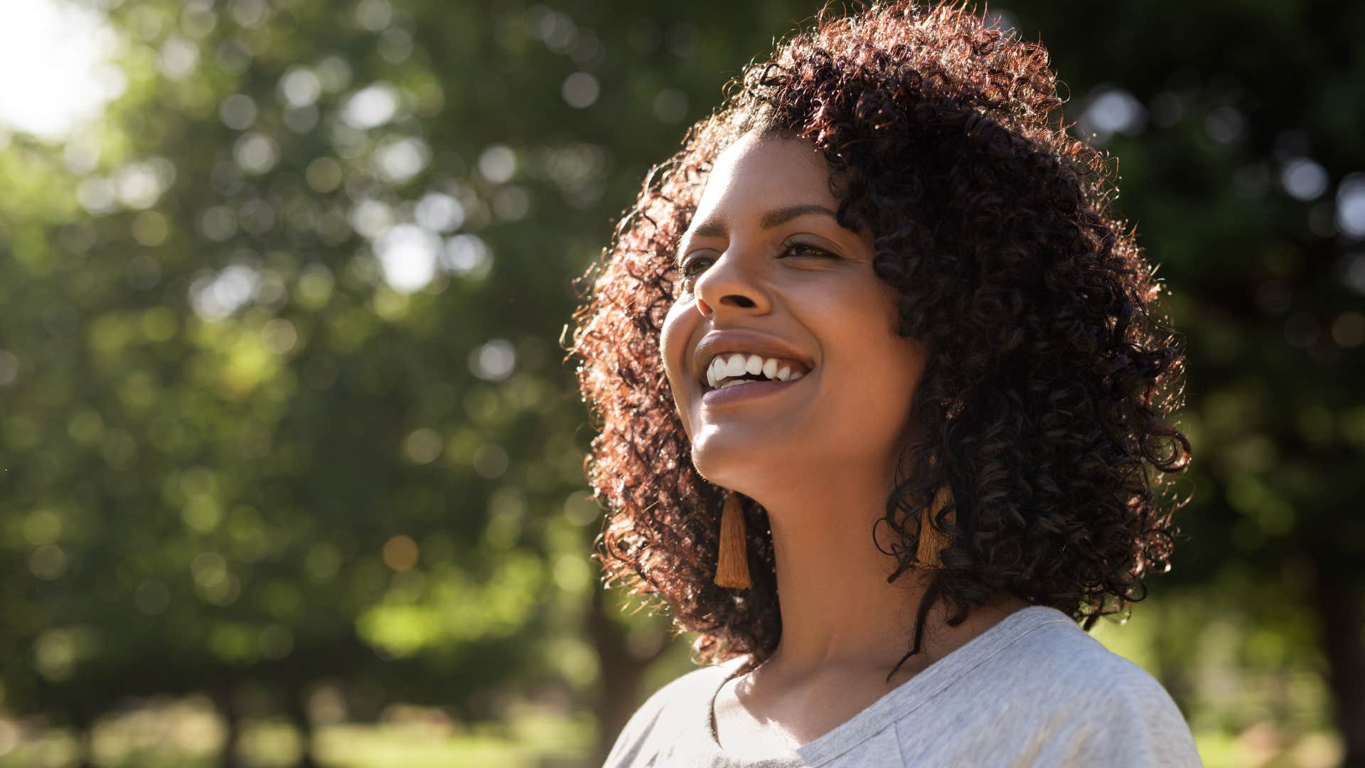 independent woman standing outside avoiding anyone she knows