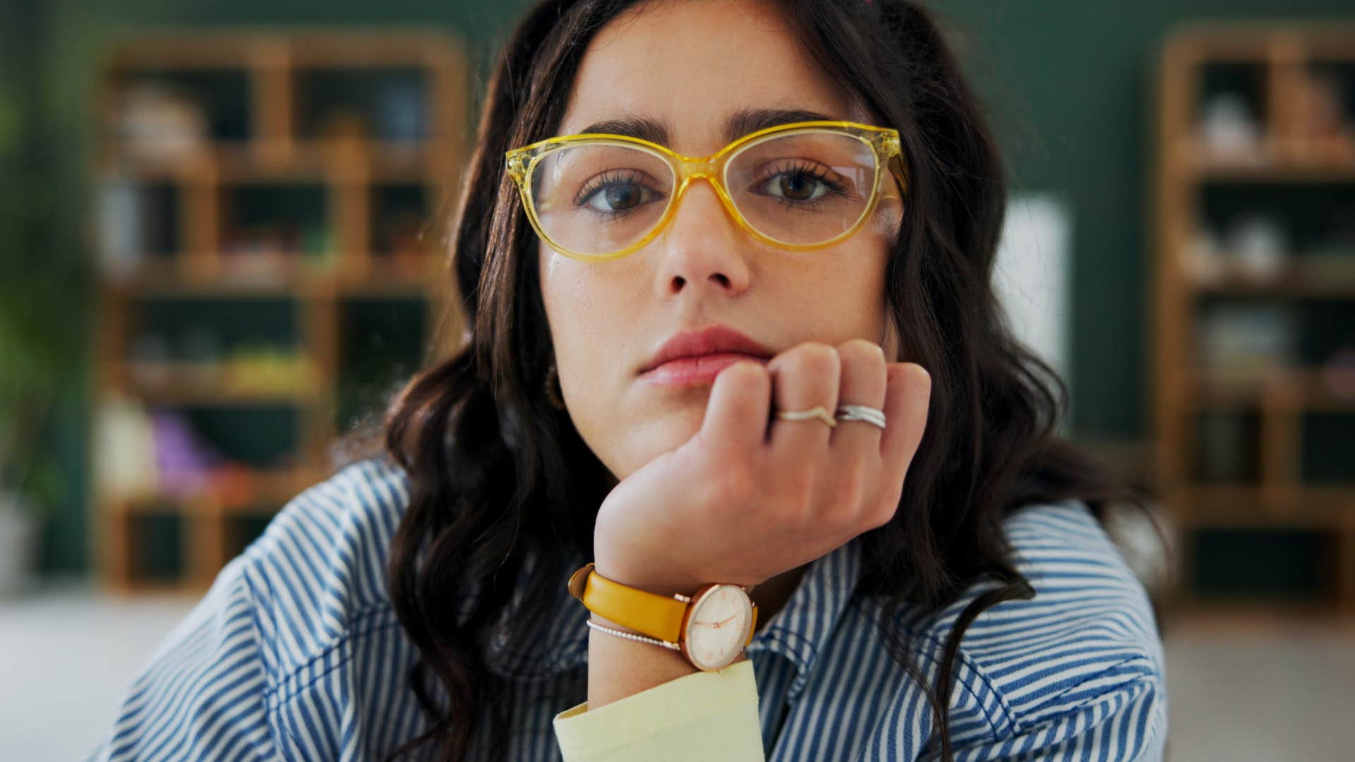 imaginative woman sitting alone at home thinking