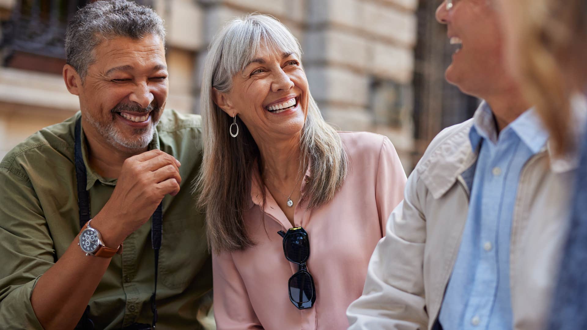 woman who overcommits when feeling motivated smiling with friends