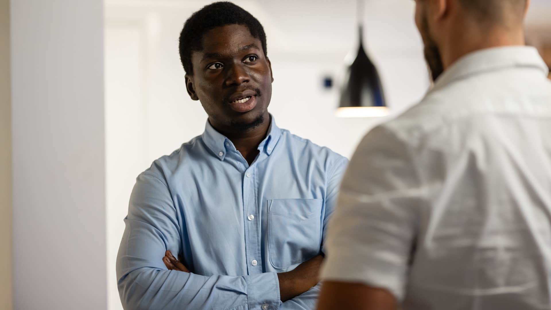Man who's comfortable with disagreements talking to a friend