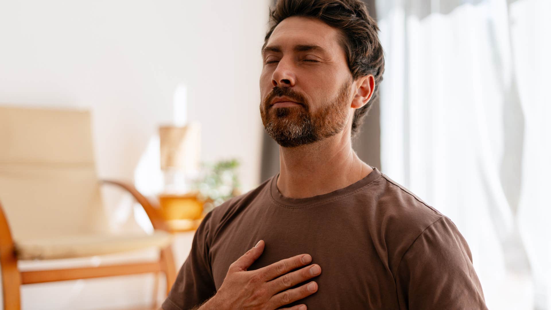 Man who values depth and slowness meditating at home