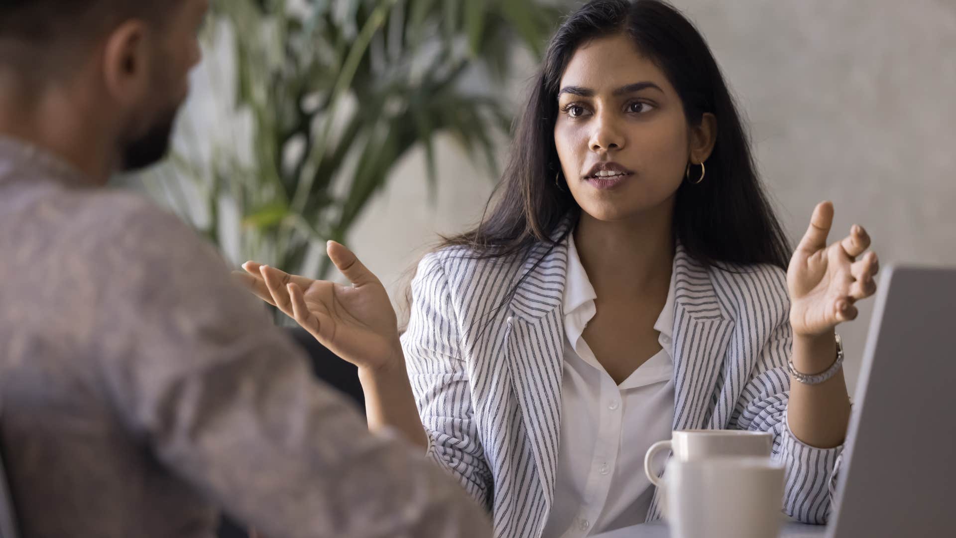 woman who's overconfident speaking in a work meeting