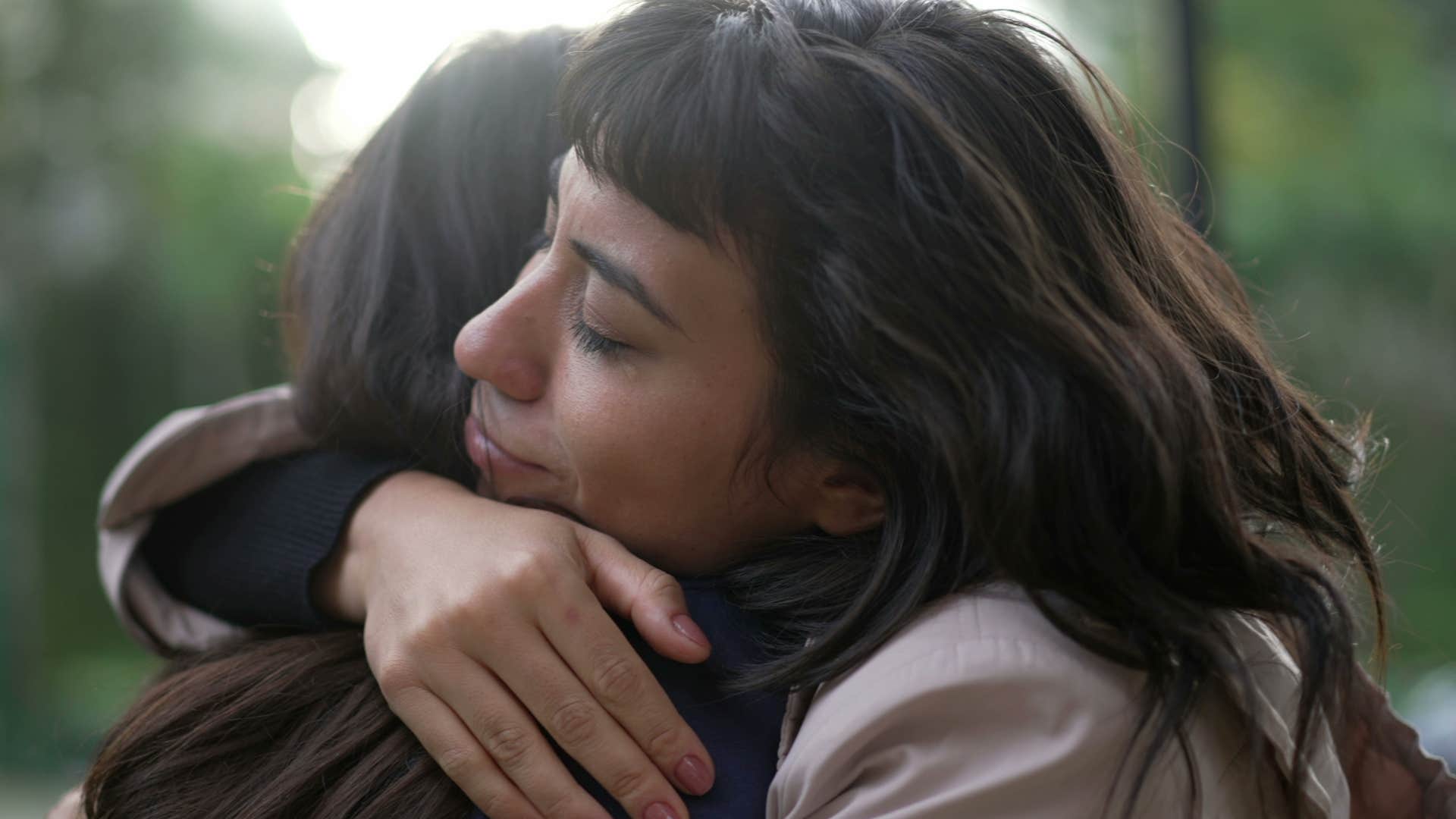spiritually gifted woman who leverages intuition to help people hugging a friend