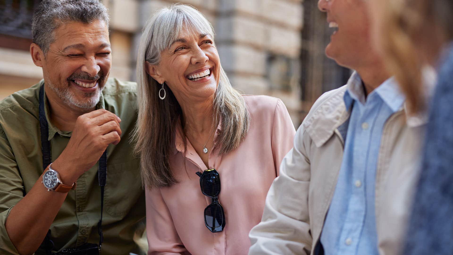 woman who magnetically attracts aligned people smiling with friends