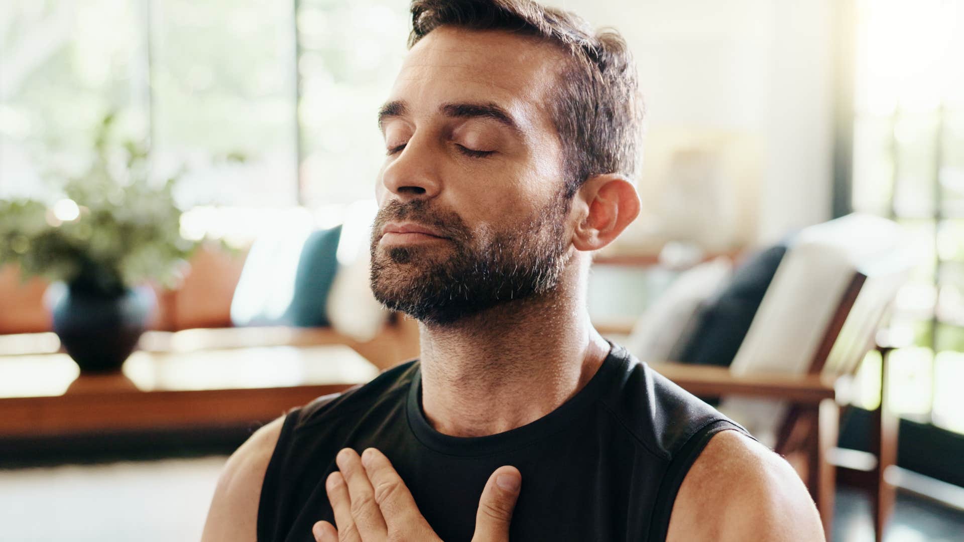 man who's naturally called toward healing meditating at home