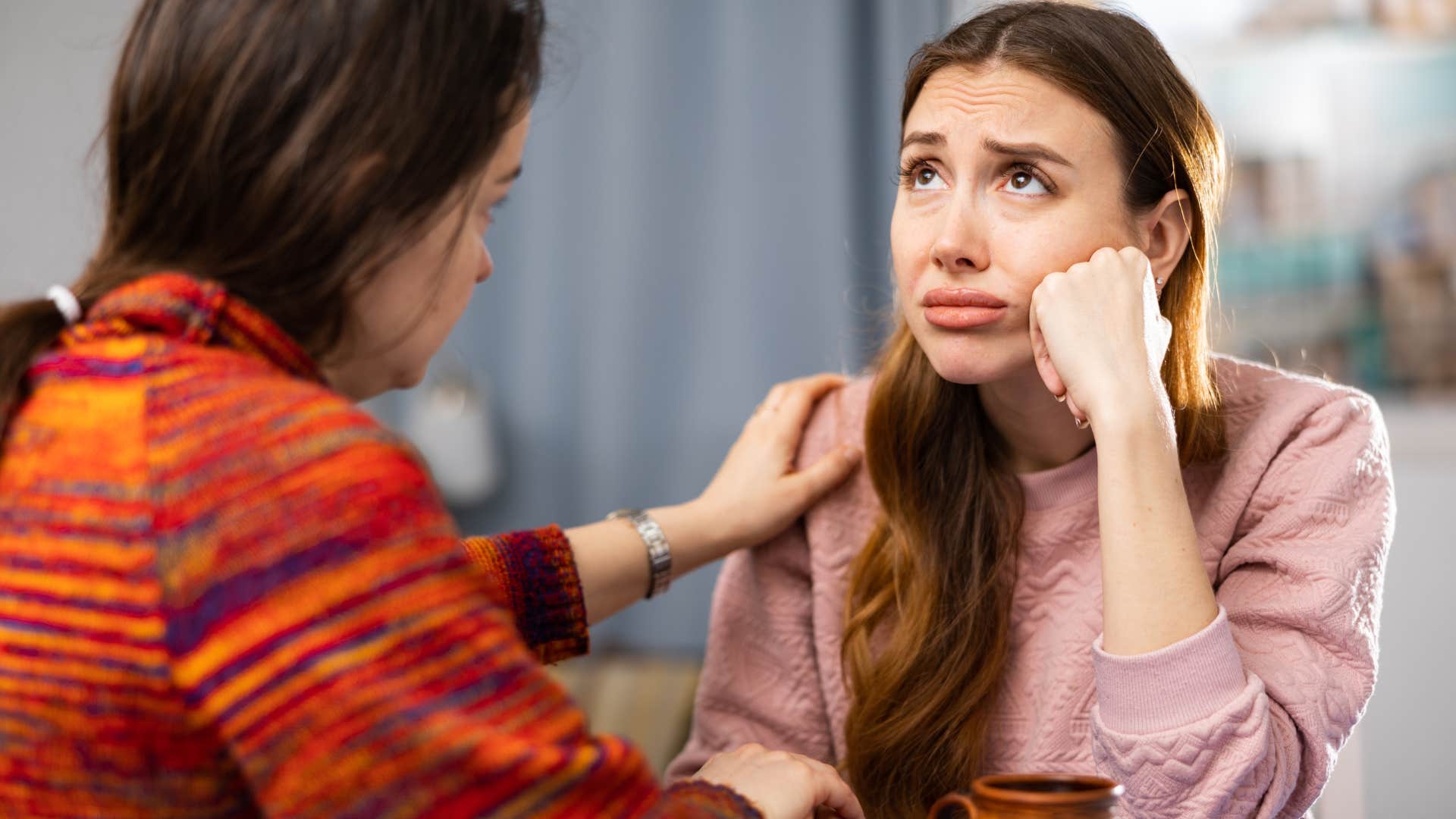 woman saying I'm so tired while complaining to her friend