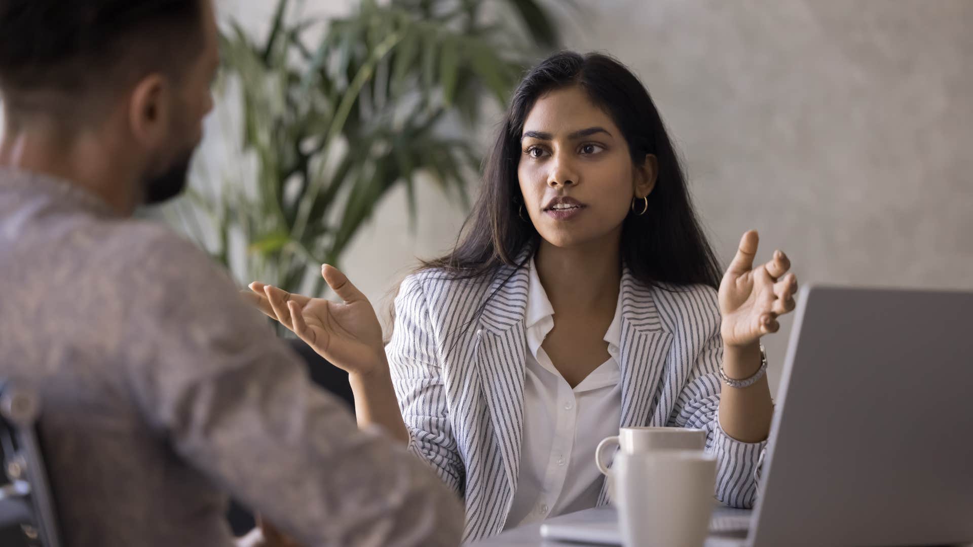 professional woman who is aware of power dynamics with colleague