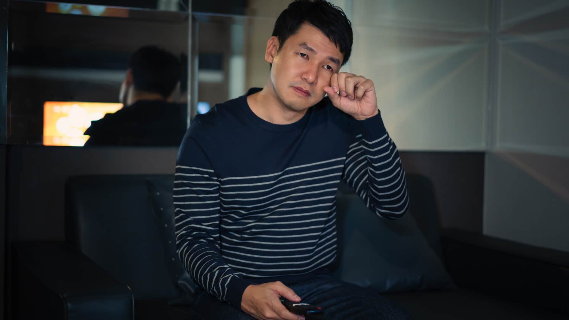 isolated man sitting by himself unable to sleep