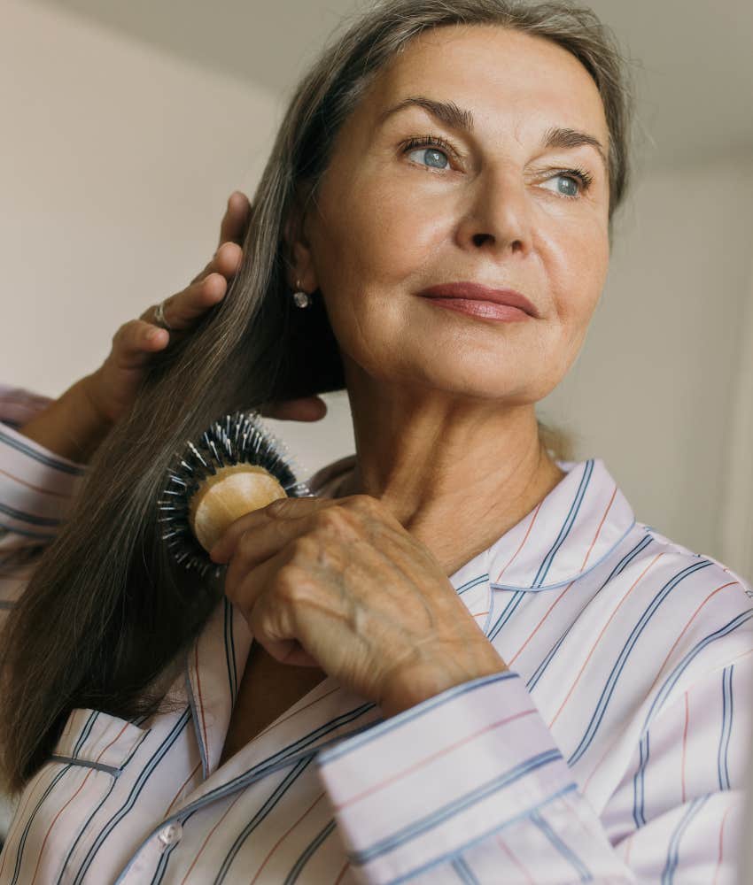 Calm person brushes hair showing good way to wake up