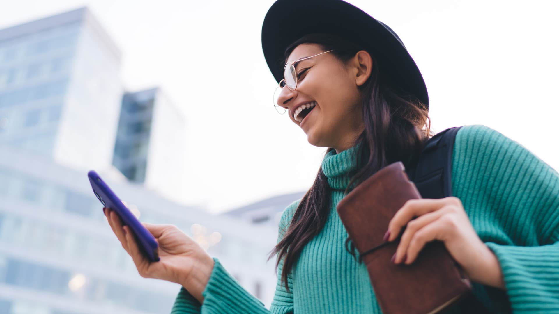 Flexible and spontaneous woman smiling outside.