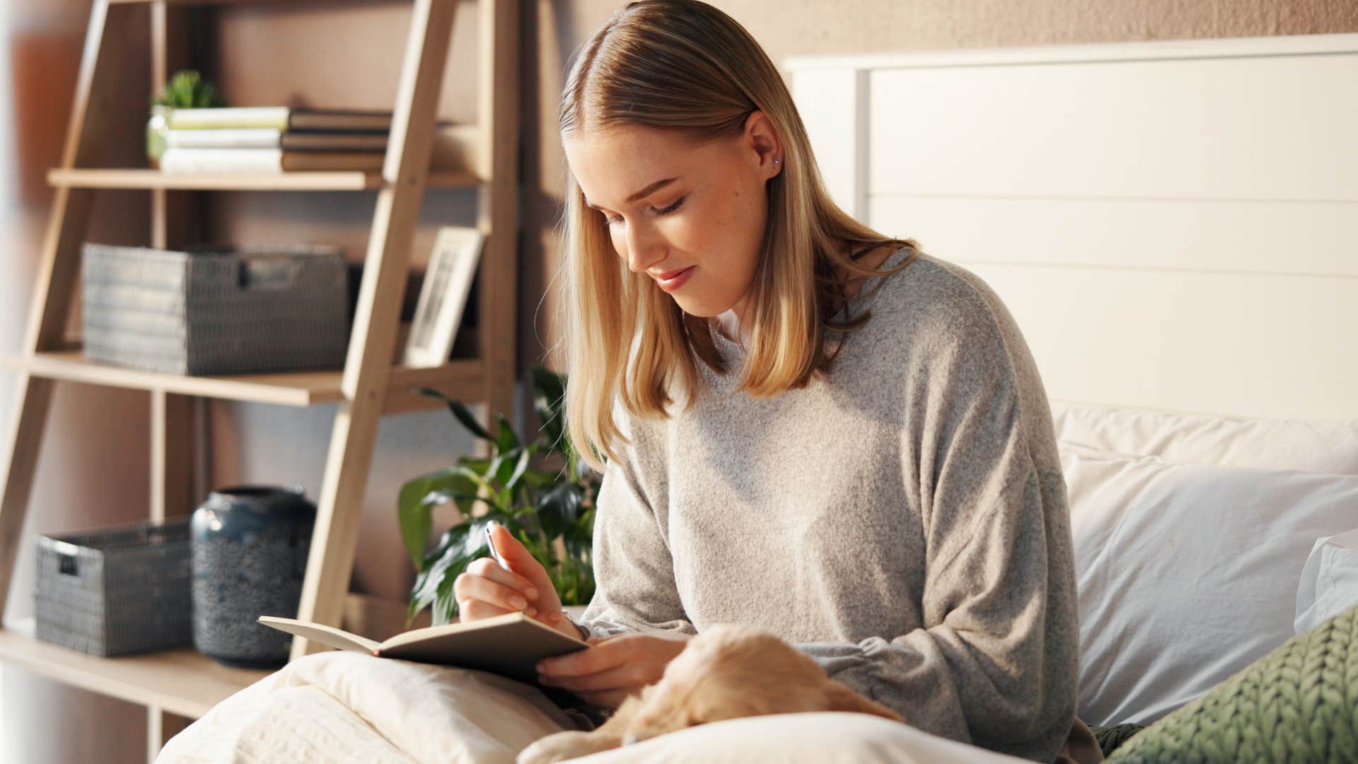 Woman who lives in the present moment reading in bed.