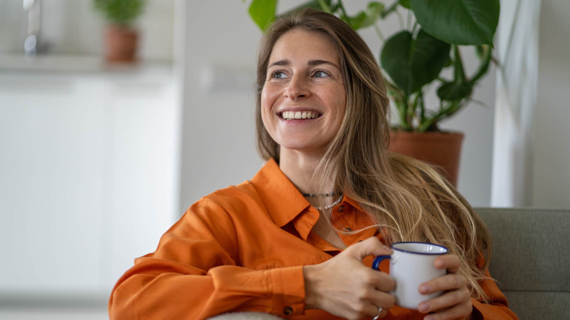 woman appreciating delayed gratification drinking tea