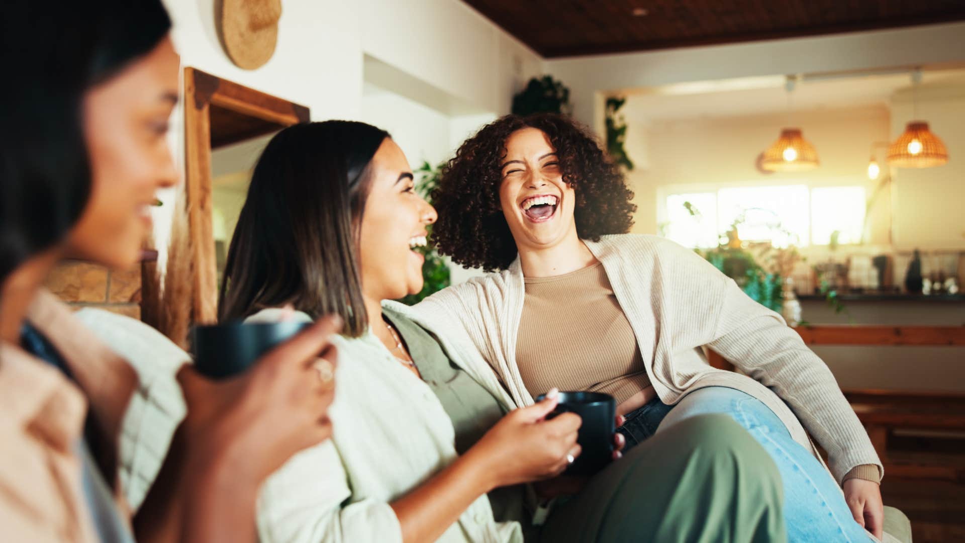 prosocial woman laughing with her friends