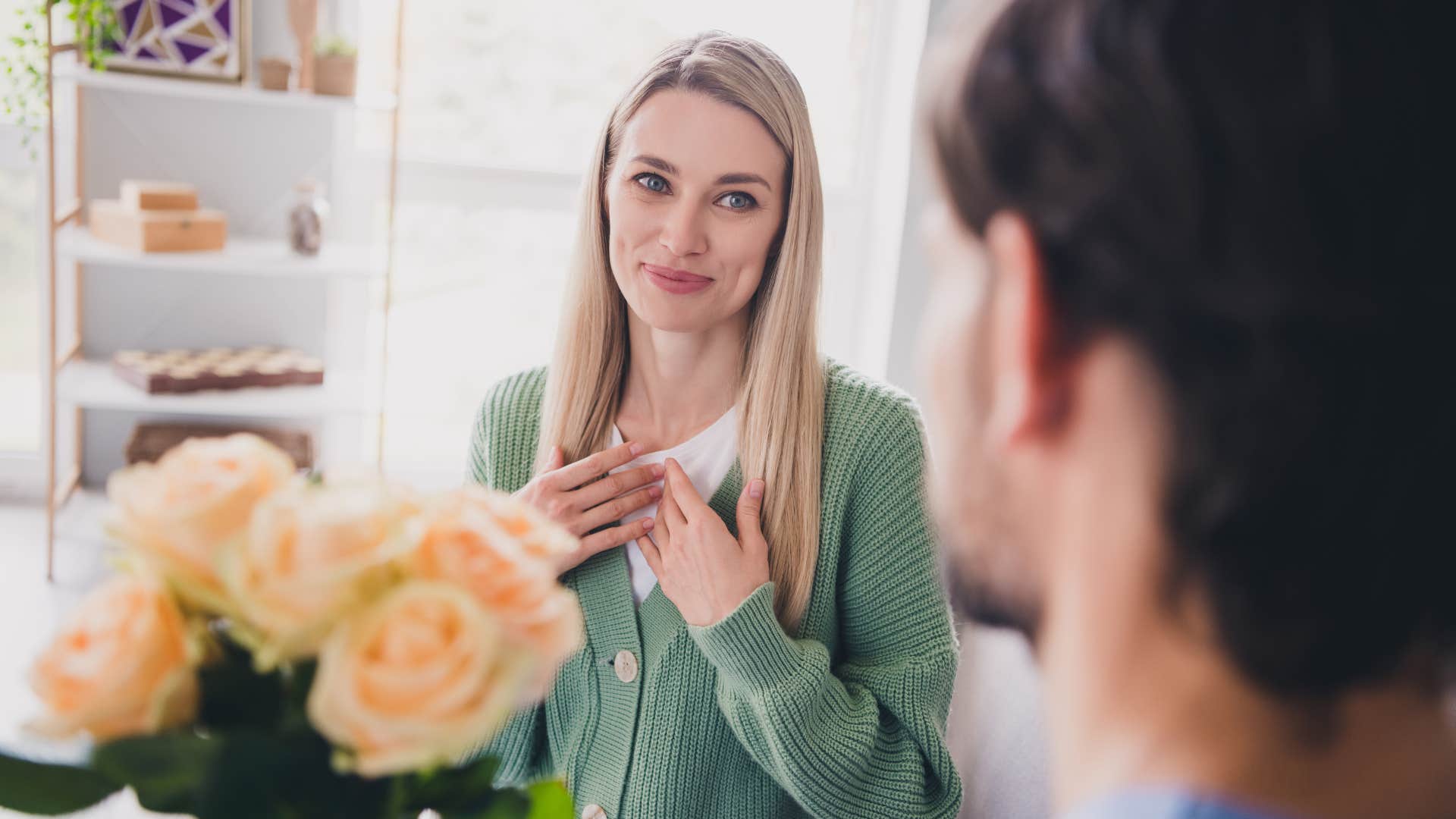 man love-bombing woman giving her flowers