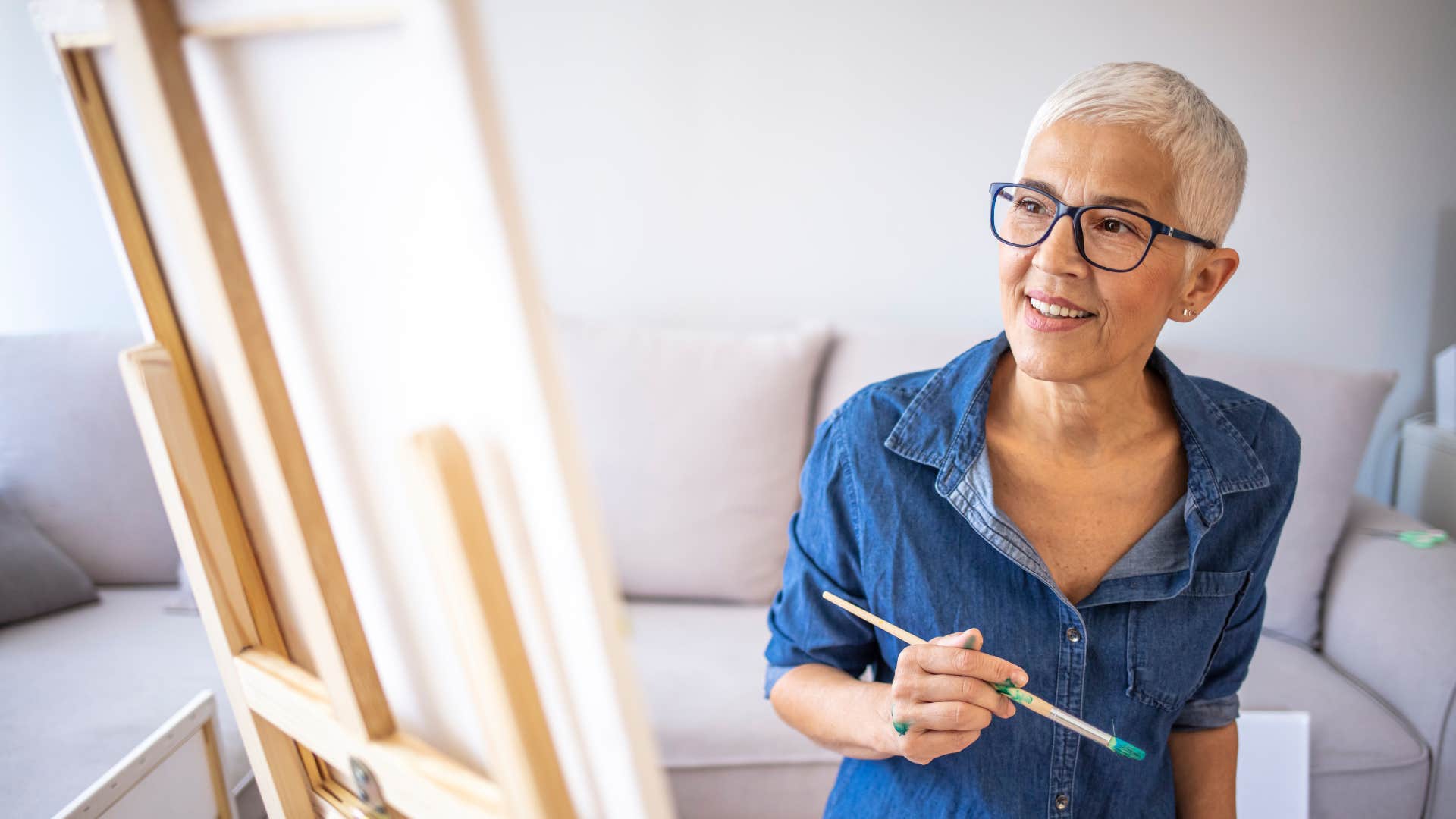 self-reliant independent woman painting on canvas