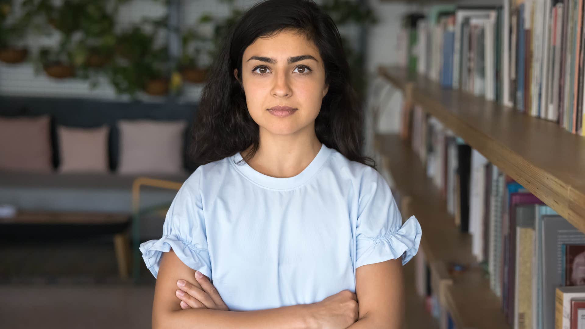 woman who appreciates silence standing in a library
