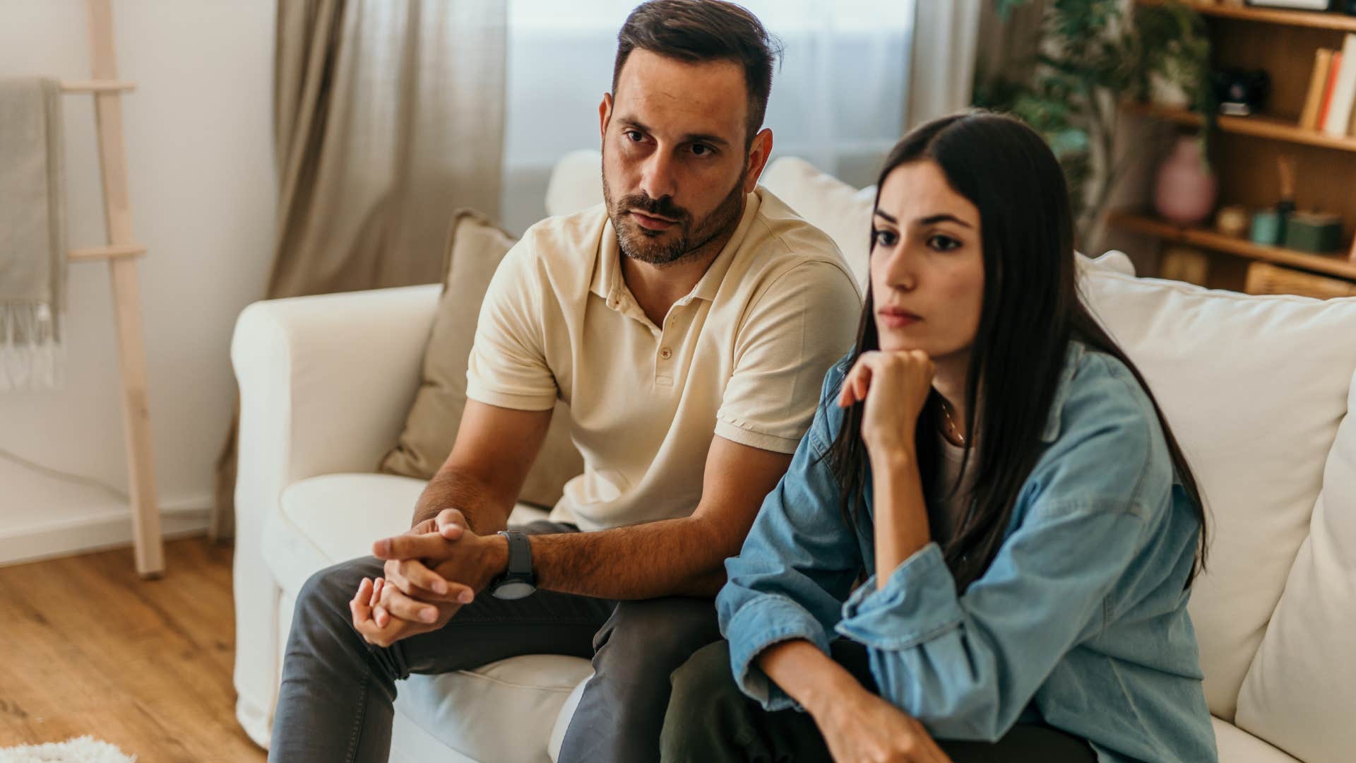 man who's comfortable being misunderstood sitting with his wife