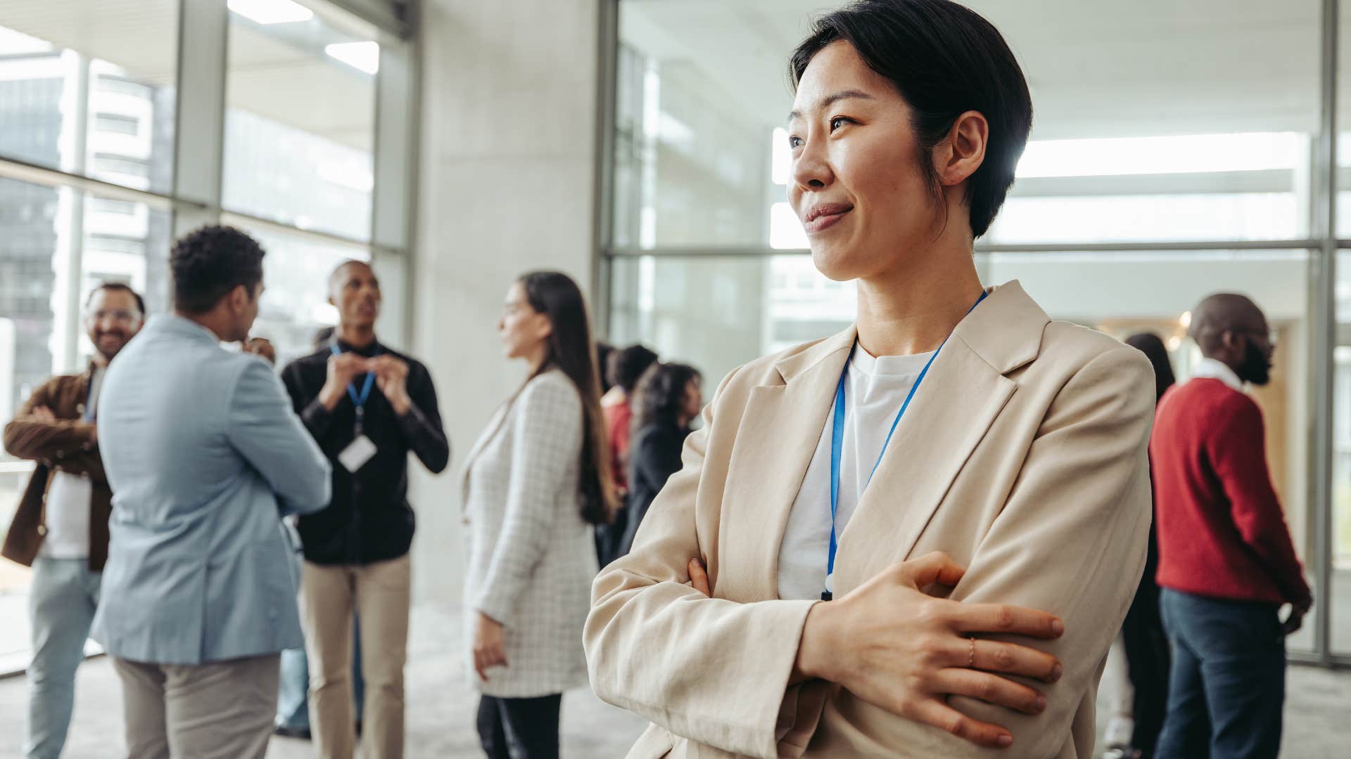 observant woman looking around at a work event