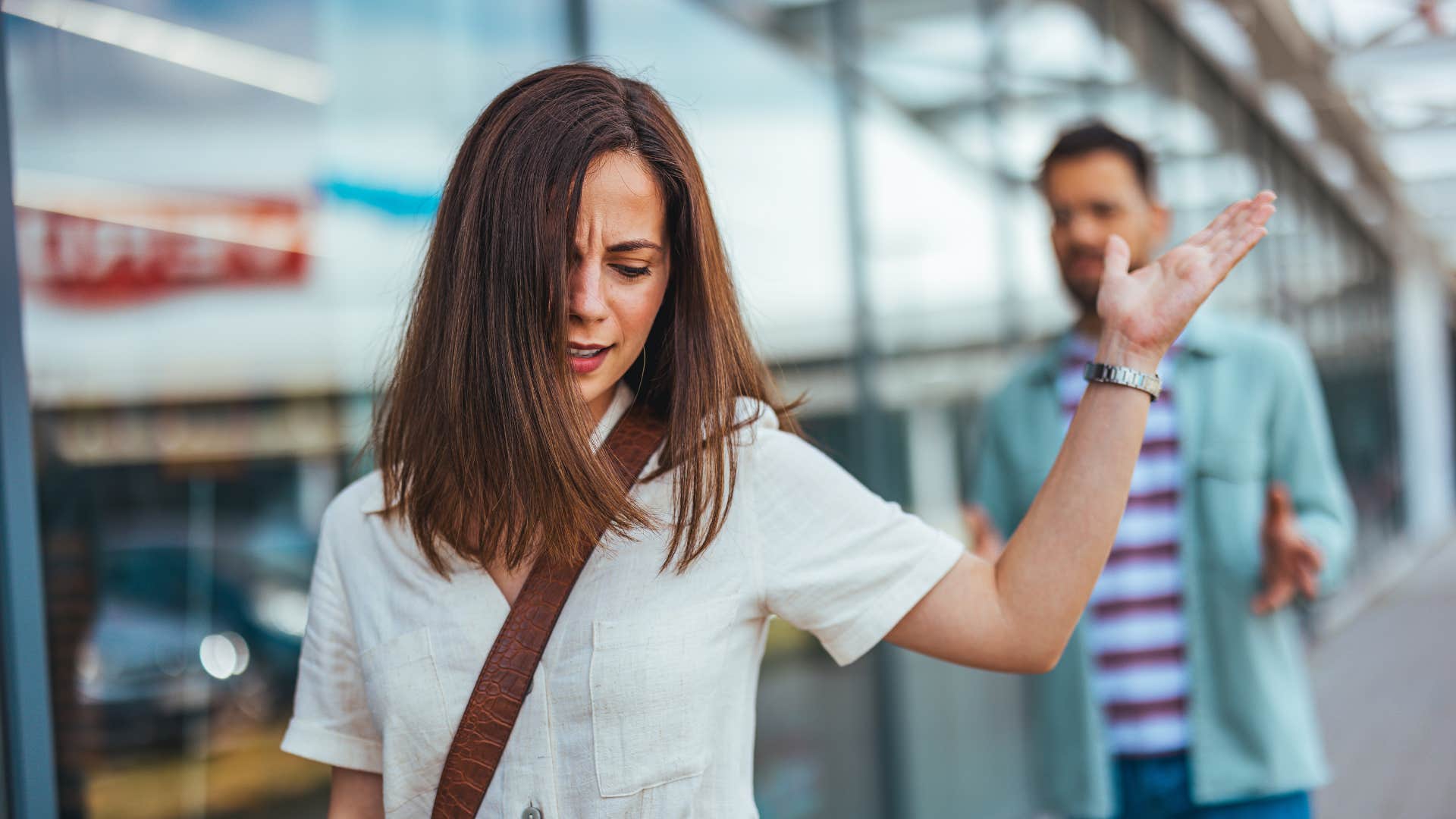 Fristrated person walks away showing importance of letting go after divorce