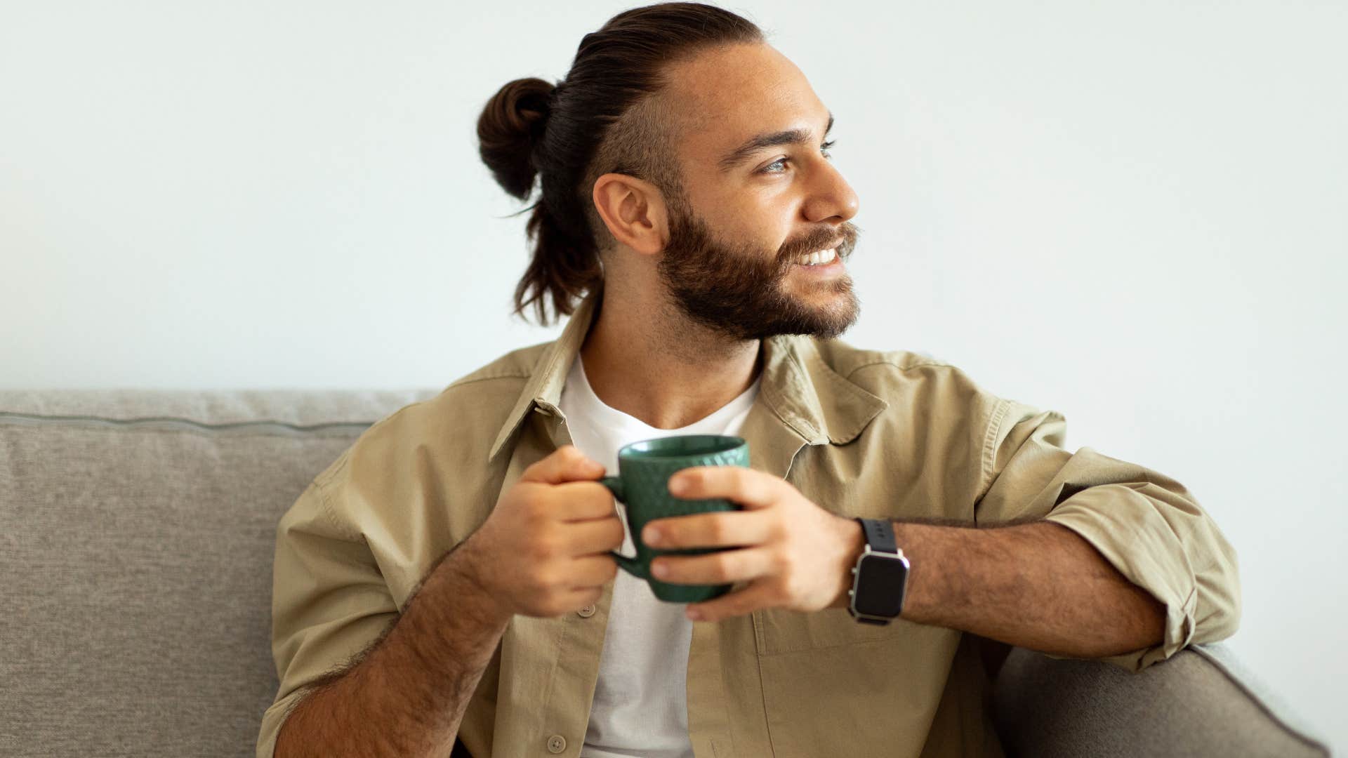 Self-aware man sitting at home.