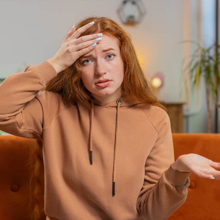 woman easily annoyed by interruptions ignoring her ringing phone