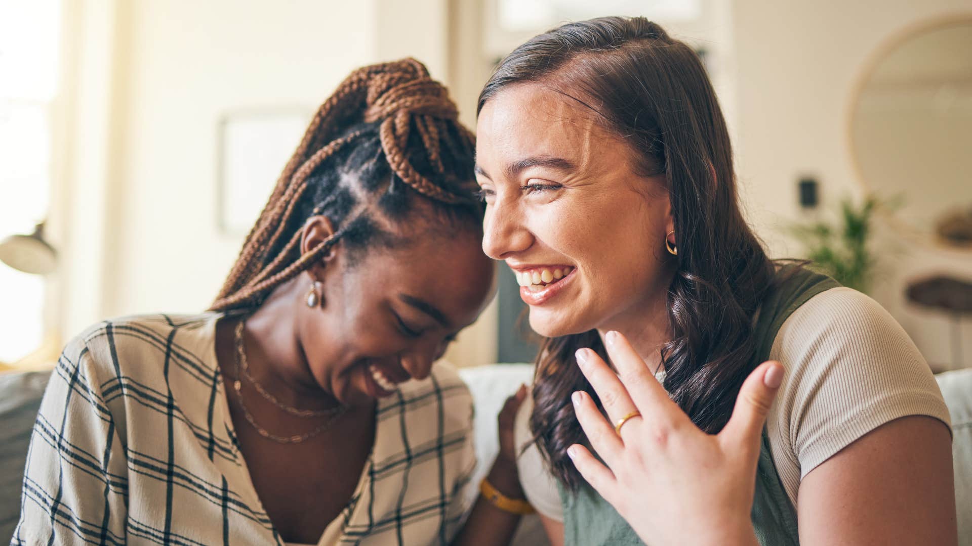 two women laughing together valuing support with one another
