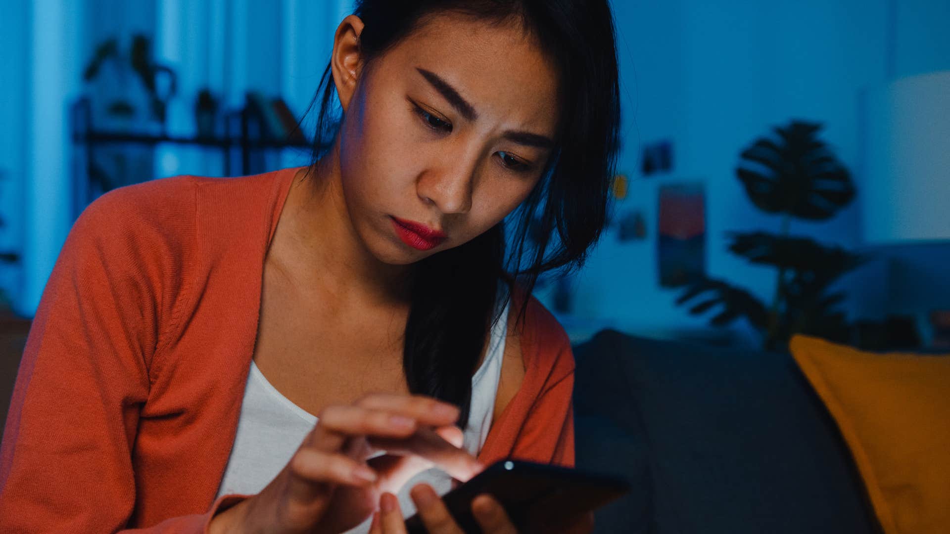 woman who values control texting on her phone at night