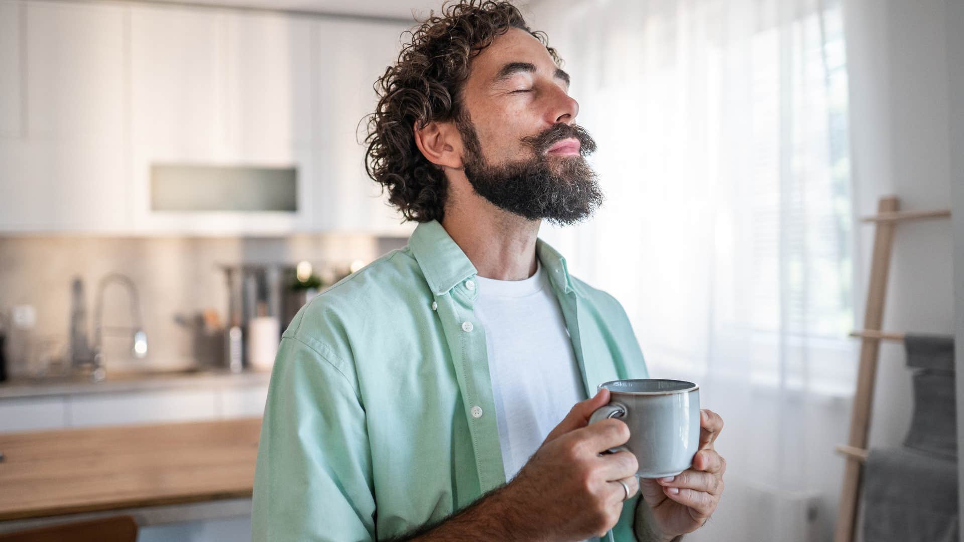 intuitive man standing calmly at home