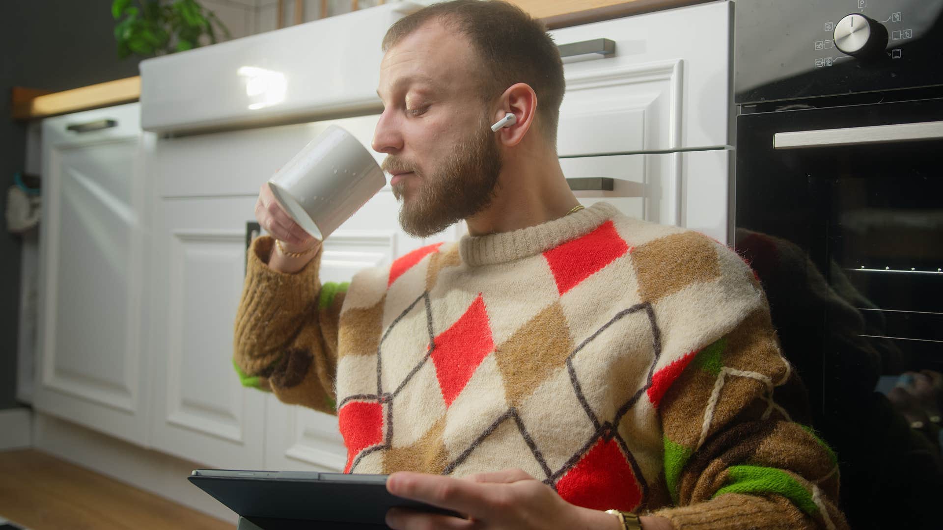 extremely private man sitting on the kitchen floor