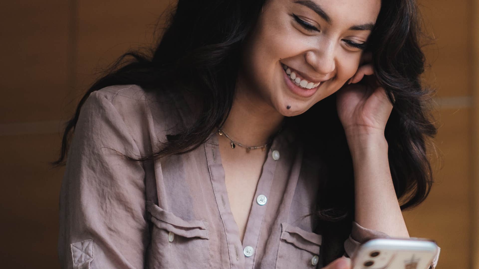 curious woman taking a screenshot she'll never look at again