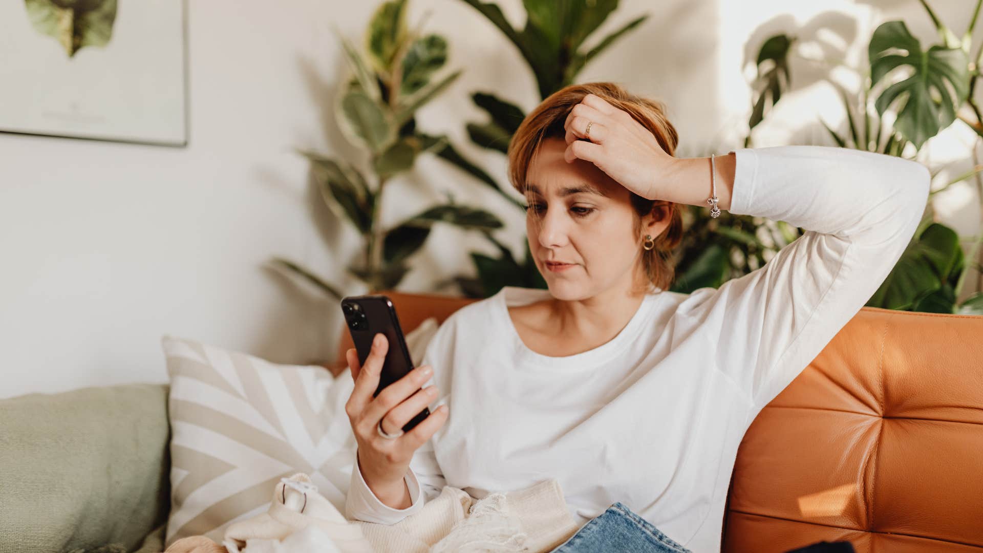 hypervigilant woman taking a screenshot she'll never look at again