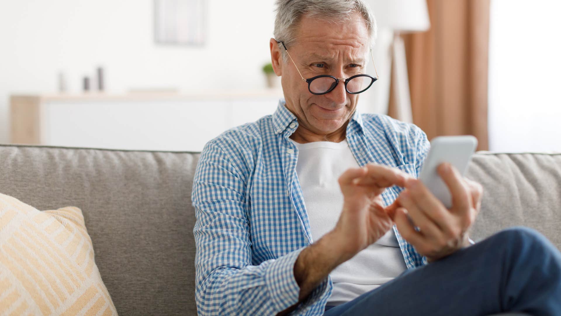 nostalgic man taking a screenshot he'll never look at again