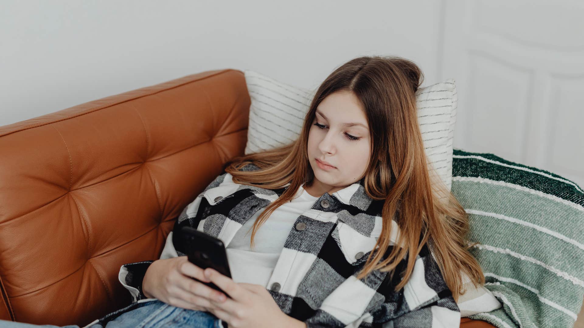 woman who feels powerless taking a screenshot on her phone she'll never look at again