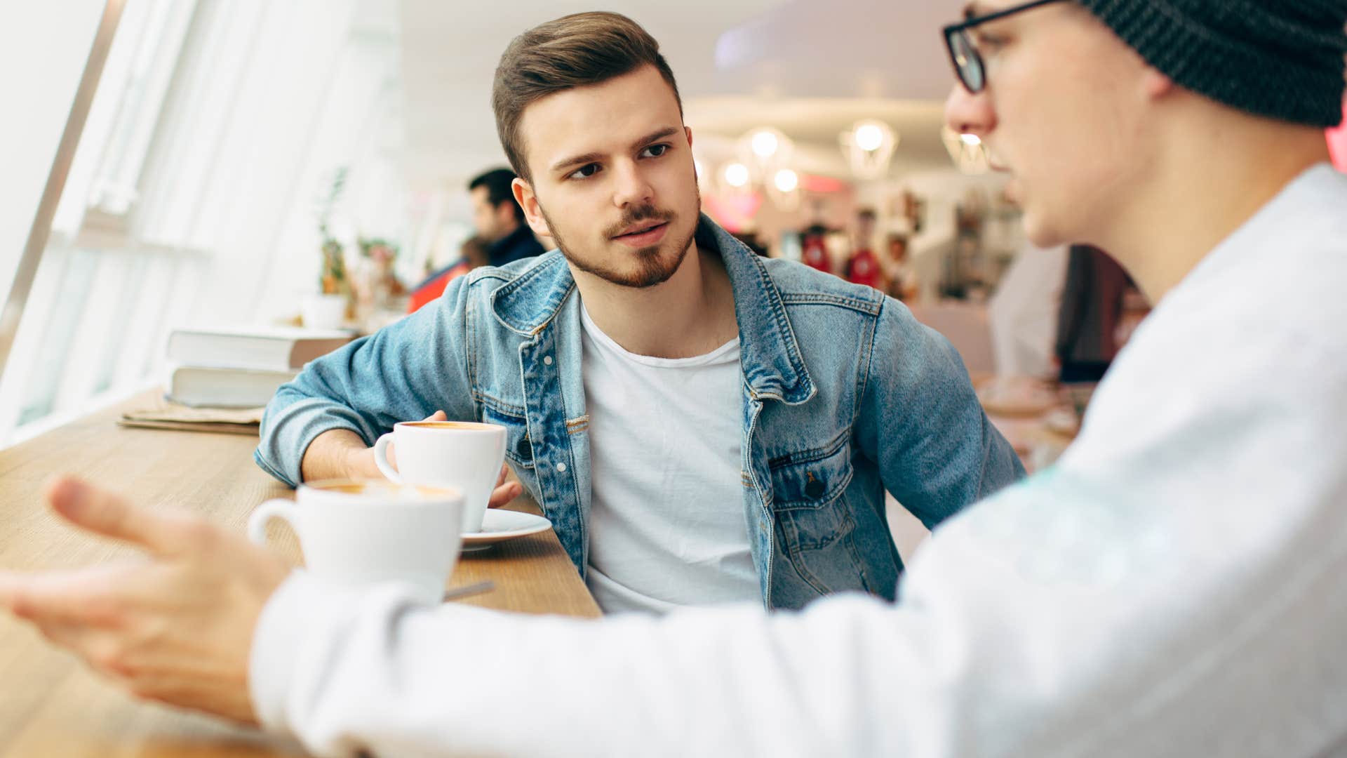 Man saying "everyone knows that" to his friend.