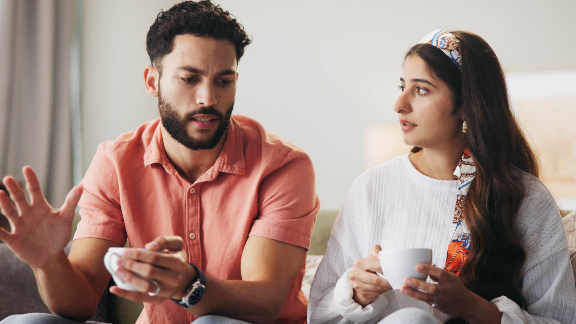 Man saying "it's just a joke" to his upset wife.