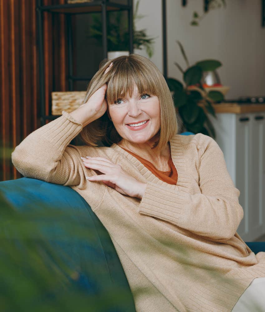 Happy person on couch showing habit