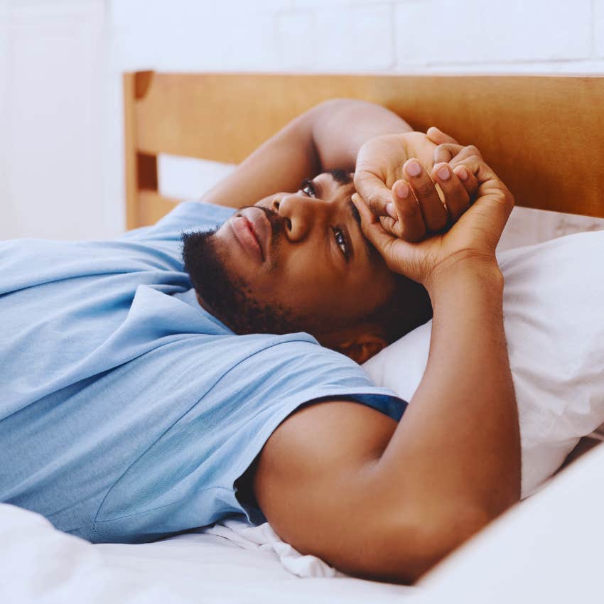 man waking up from strange dream after sleeping on left side