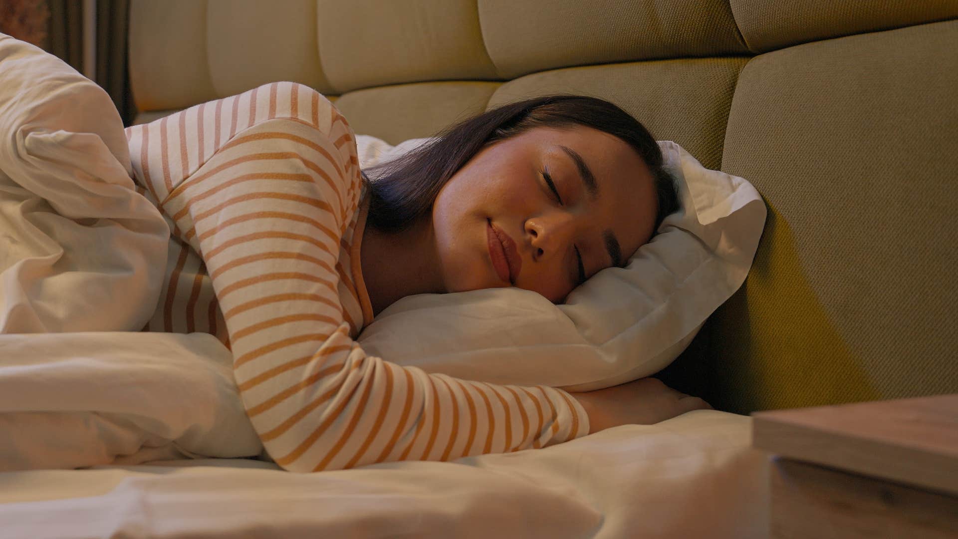 self-regulated woman sleeping in her bed