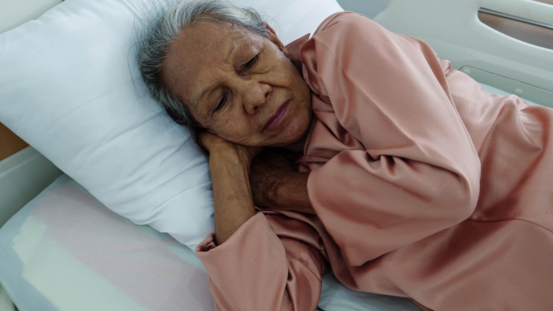 sensitive woman sleeping with t-rex arms in her bed