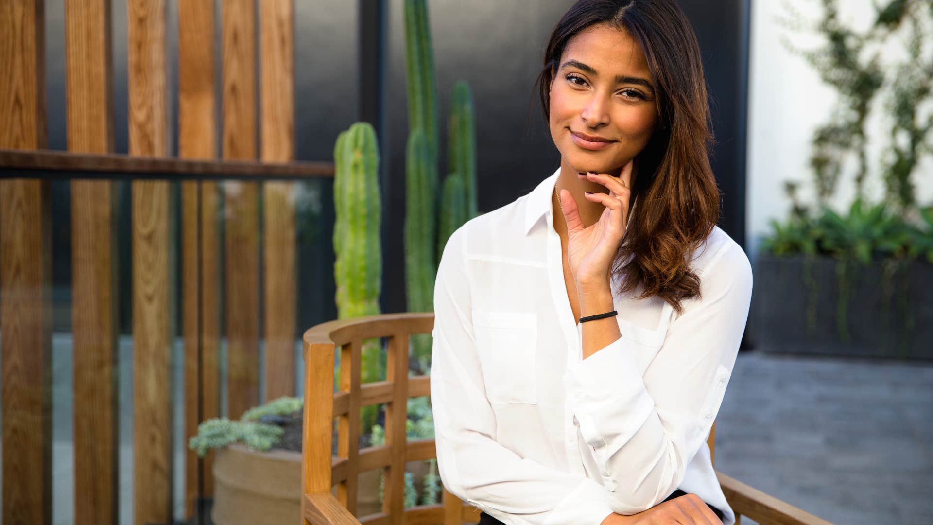 naturally empathetic and caring woman smiling outside