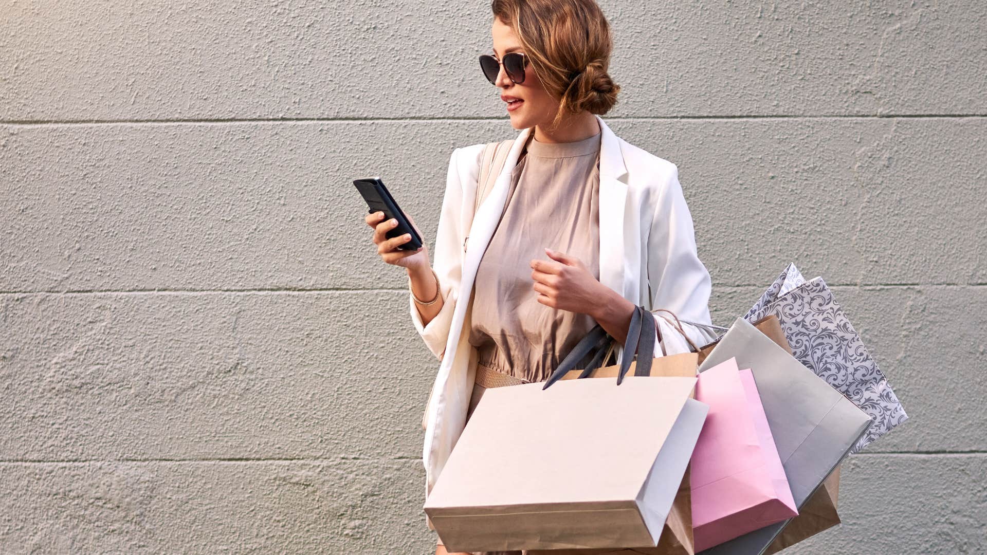woman who spends tons of money on little things because shopping is her coping mechanism